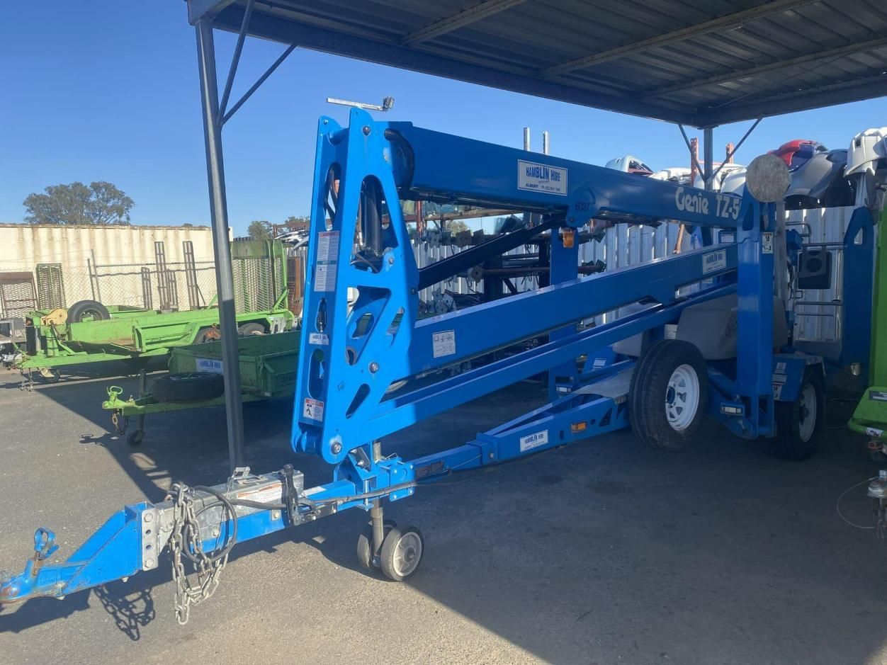 A Blue Crane is Parked Under a Roof in a Parking Lot — Hamblin Hire in Albury, NSW