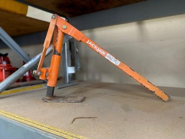 A Jackhammer is Sitting on Top of a Wooden Table — Hamblin Hire in Albury, NSW