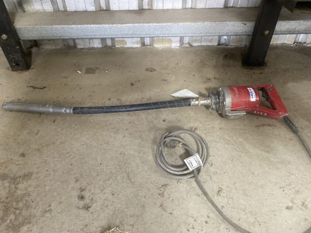 A Concrete Vibrator With a Cord Attached to It is Sitting on the Ground — Hamblin Hire in Albury, NSW