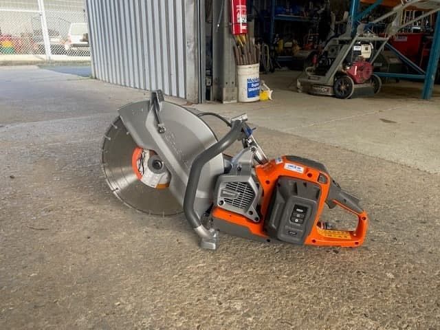 A Concrete Saw is Sitting on the Ground in Front of a Building — Hamblin Hire in Albury, NSW