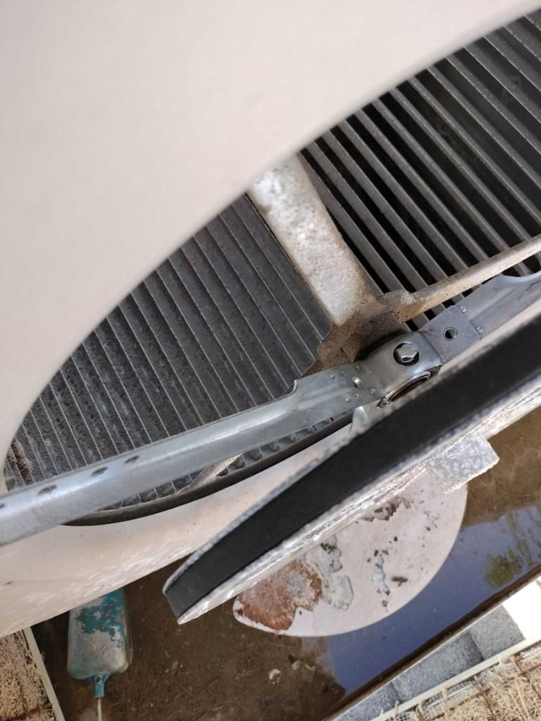 Exterior air conditioning unit fan and grilles.