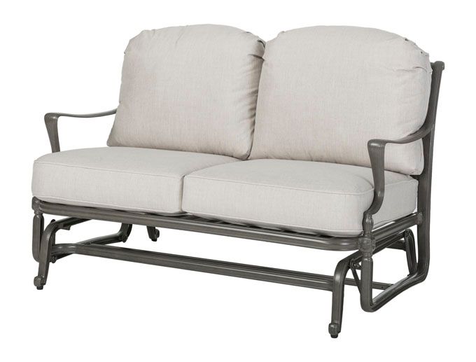 A grey couch with white cushions on a white background