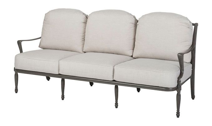 A couch with three pillows on a white background.