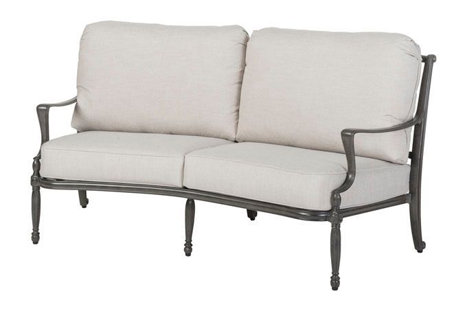A couch with white cushions on a white background.
