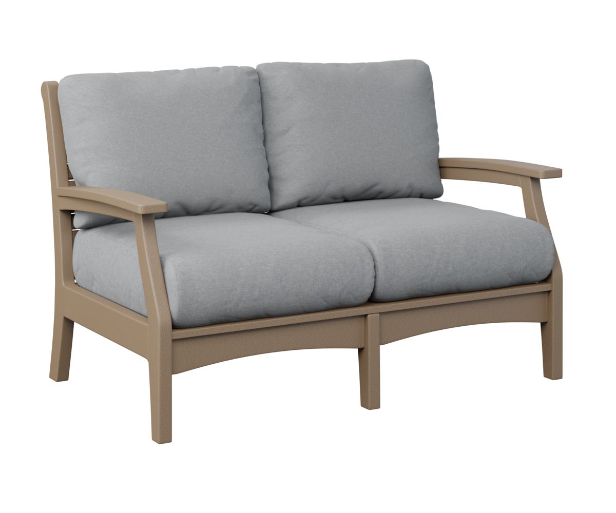 A brown couch with grey cushions on a white background