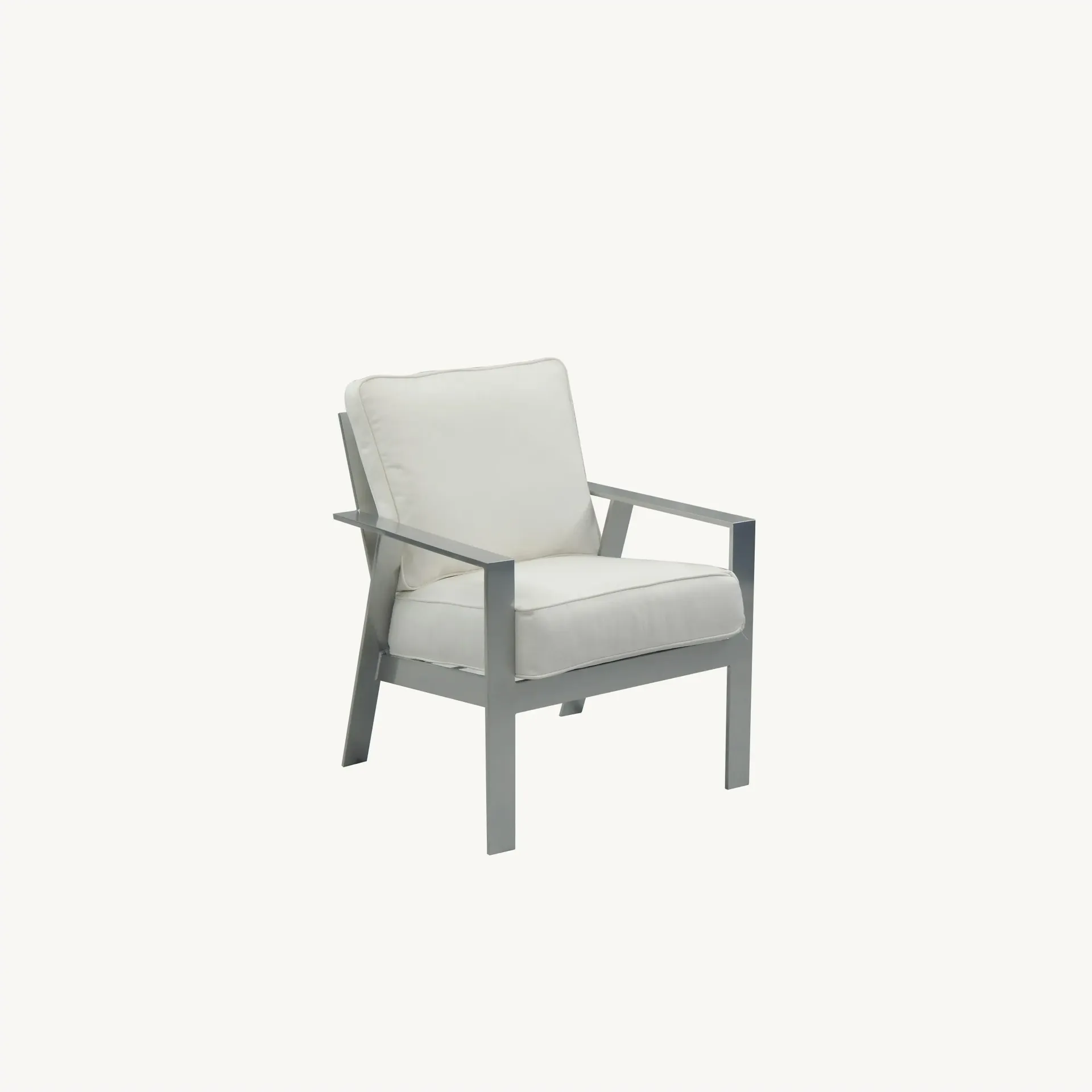 A white chair with a white cushion on a white background.
