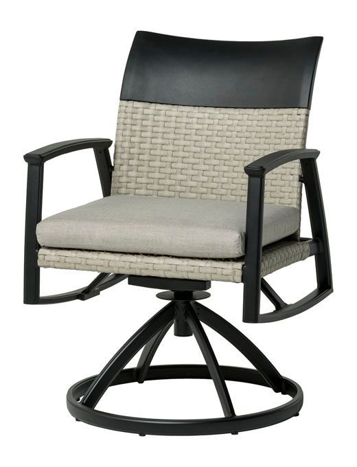 A wicker chair with a grey cushion on a white background