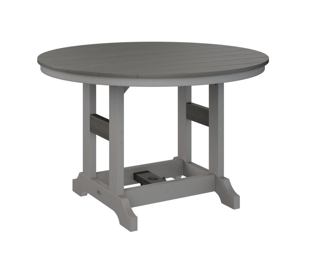 A round table with a gray top and white legs on a white background.