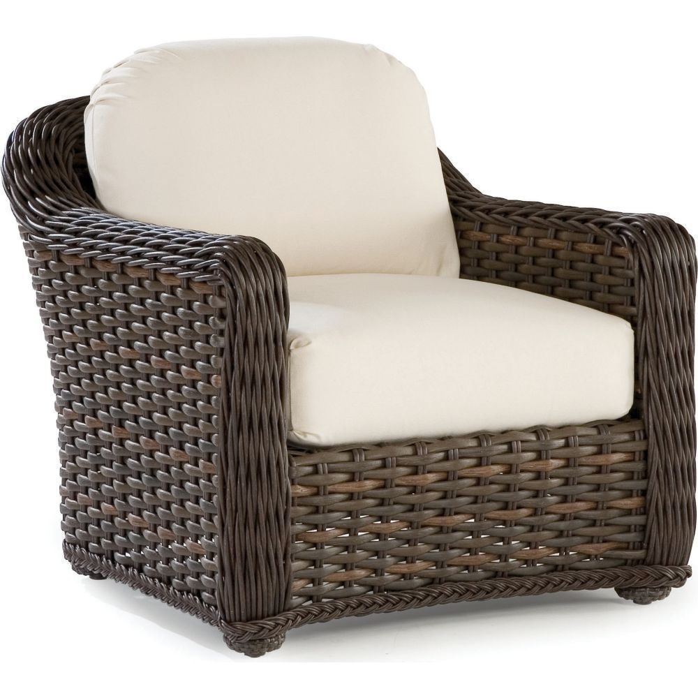 A wicker chair with a white cushion on a white background