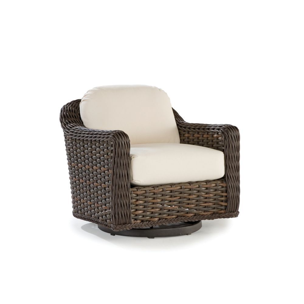 A brown wicker chair with a white cushion on a white background.