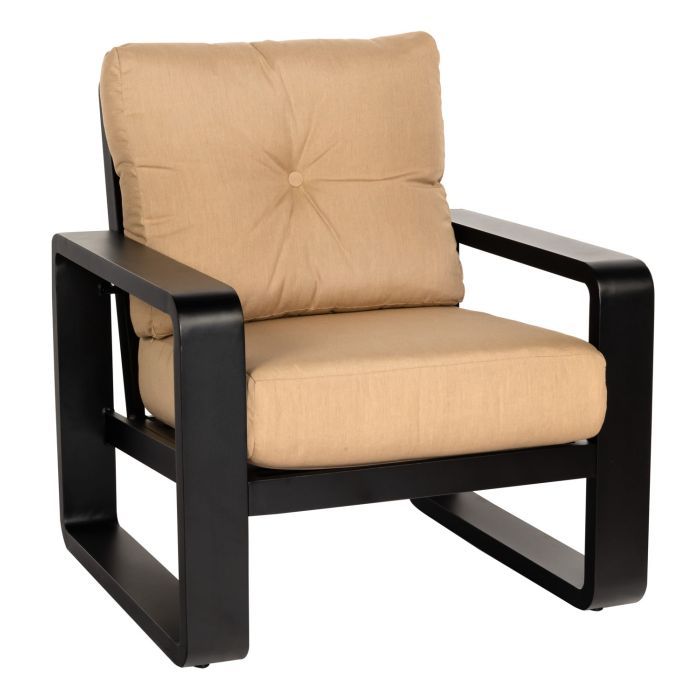 A chair with a tan cushion and black frame
