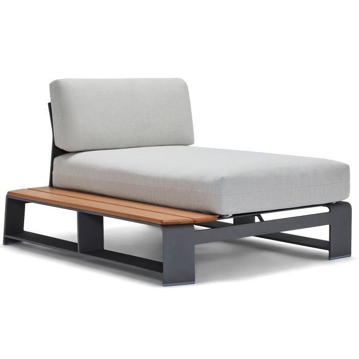 A chaise lounge with a wooden bench underneath it
