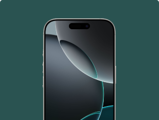 A close up of a cell phone on a green background