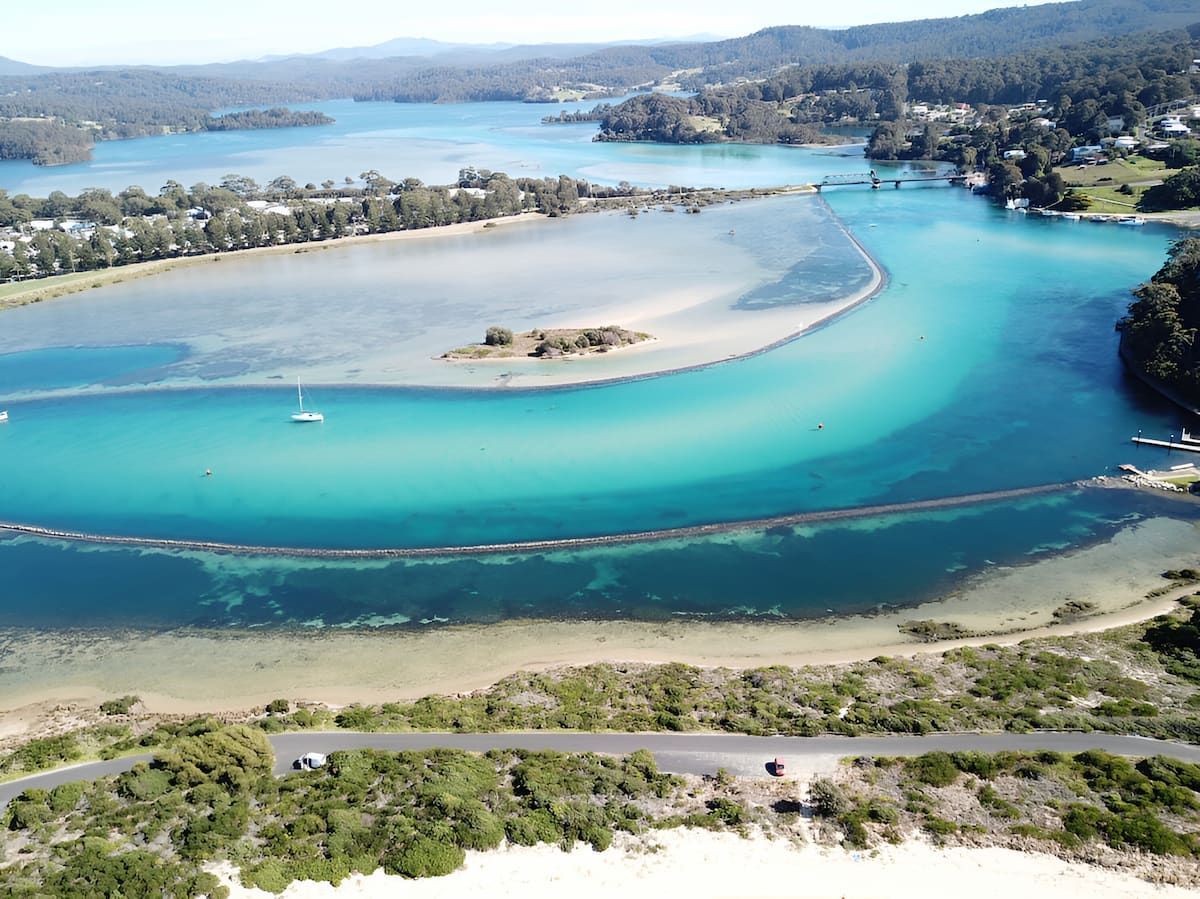 Aerial View of Turquoise Water, a Sandbar, and a Bridge — Dirt Werx in Narooma, NSW