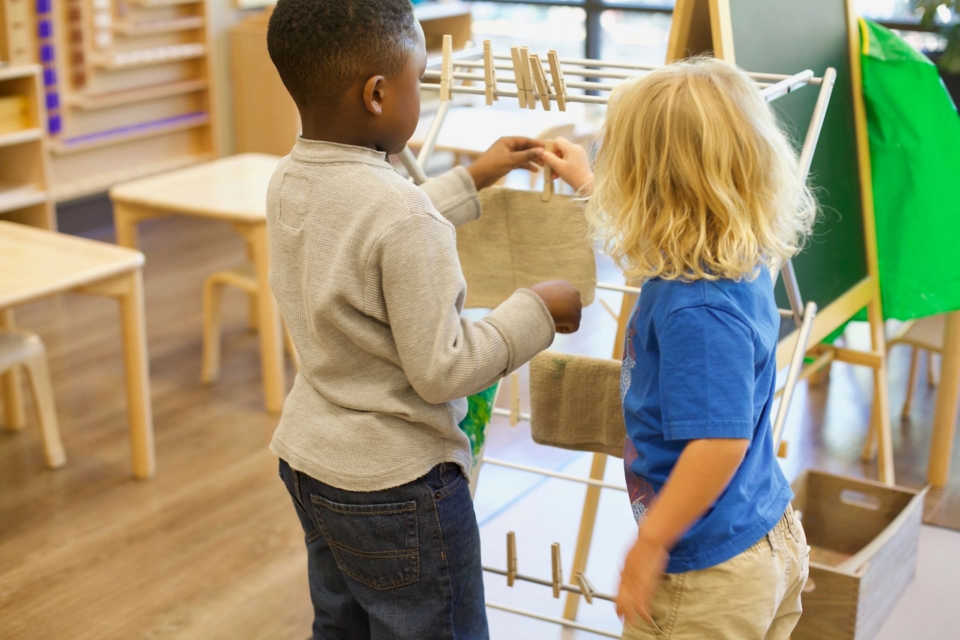 Two children in a Montessori Classroom. 