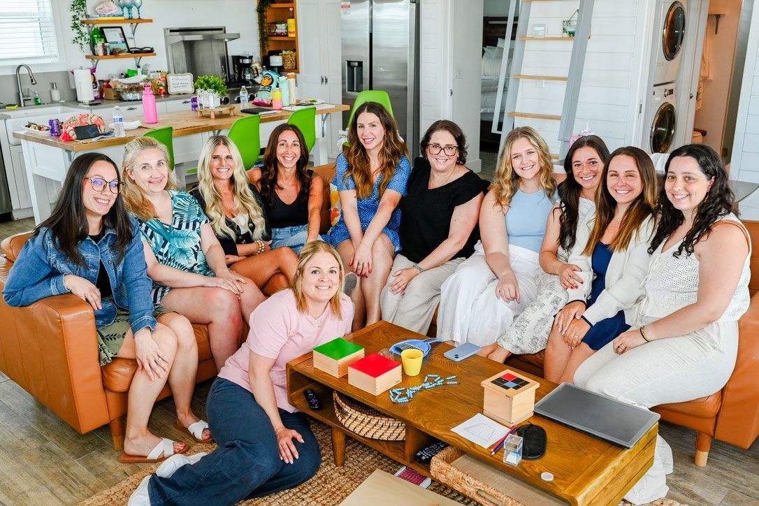 montessori workshop gathered in living room for group meeting