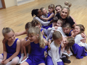 laughing and smiling group of little girls after dance lesson with teacher