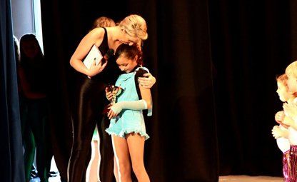 little girl receiving an award