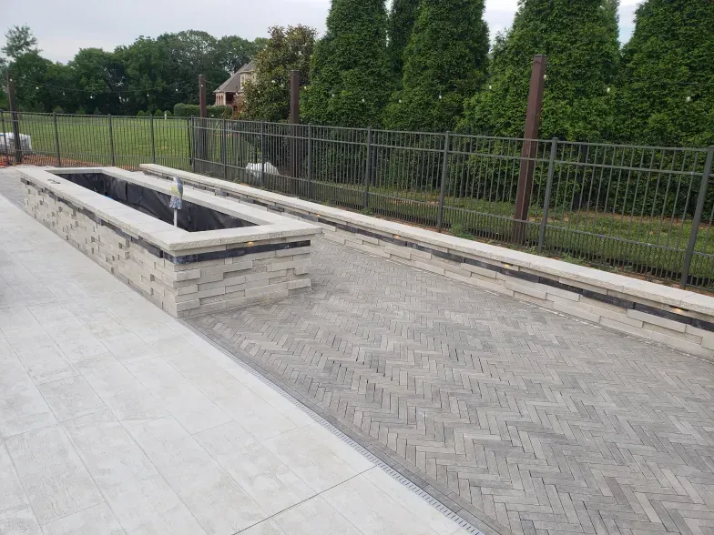 There is a fountain in the middle of the patio.