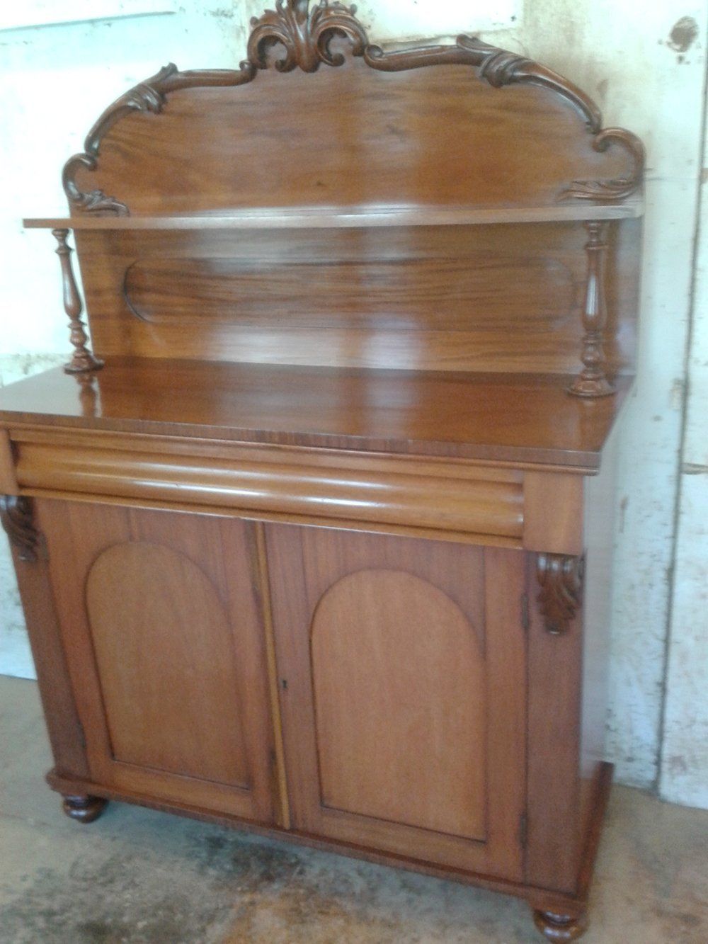 Mahogany chiffonier.  Family dog had eaten the corner. Corner rebuilt, stained and polished to match.