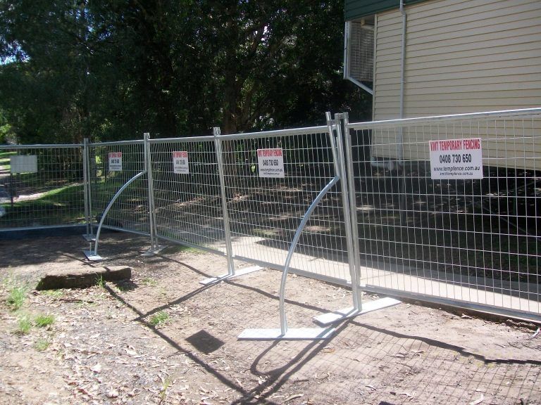 A fence with a caution sign on it