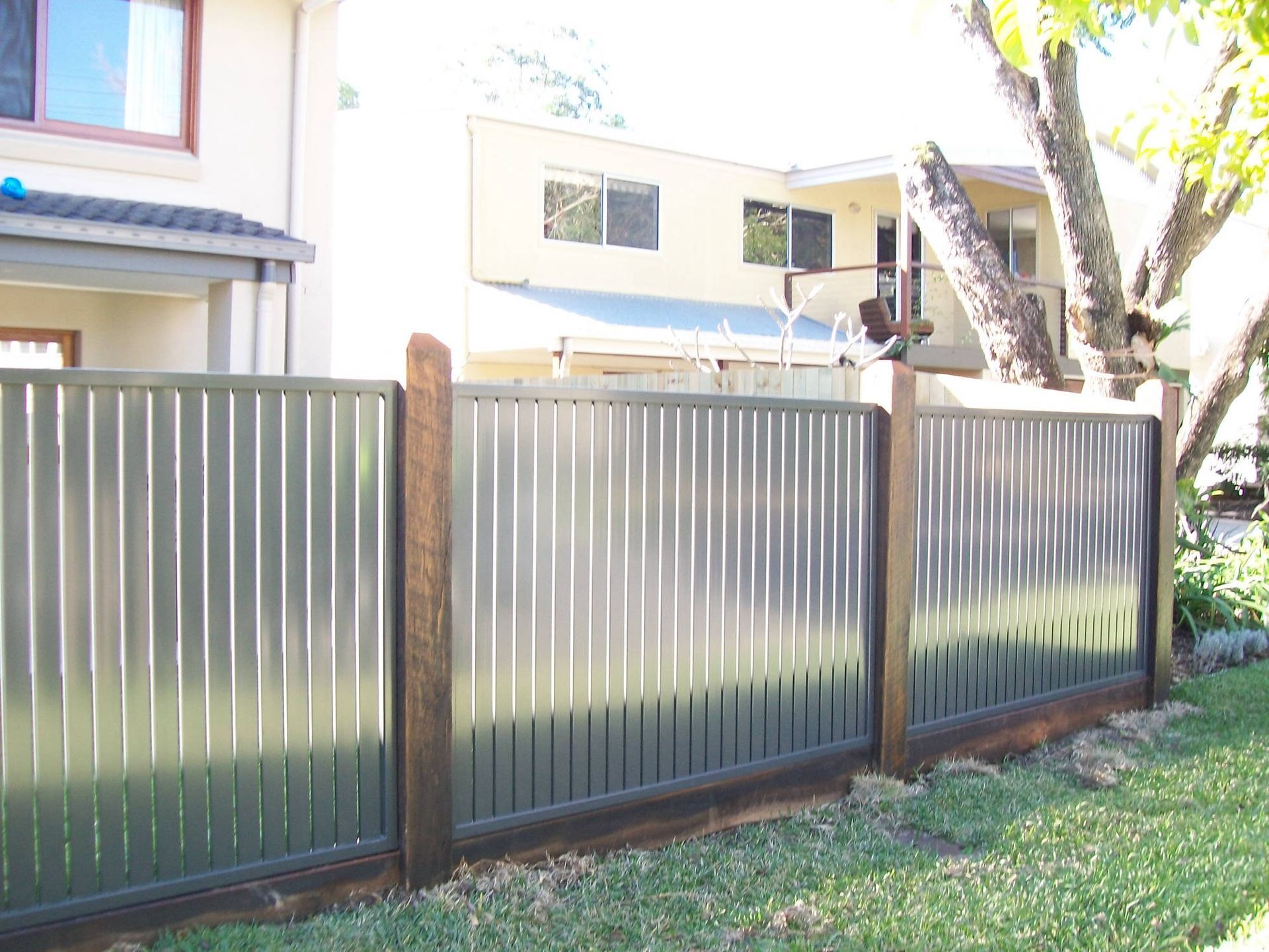 A house with a fence in front of it