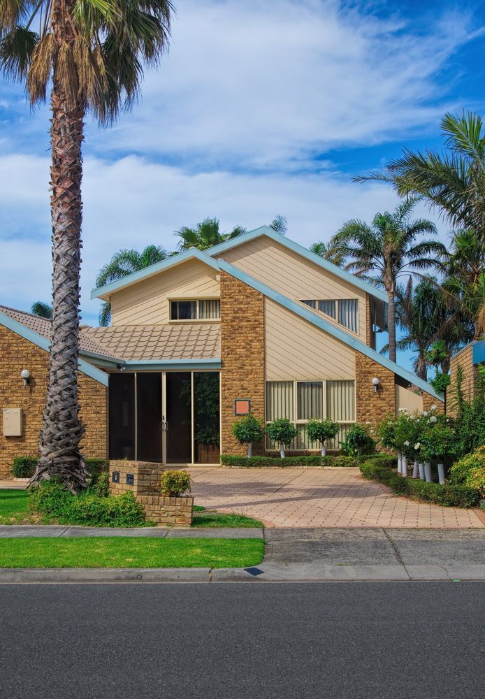 Suburban Brick House With Beige Siding — Gatley Building Design in Coral Cove, QLD