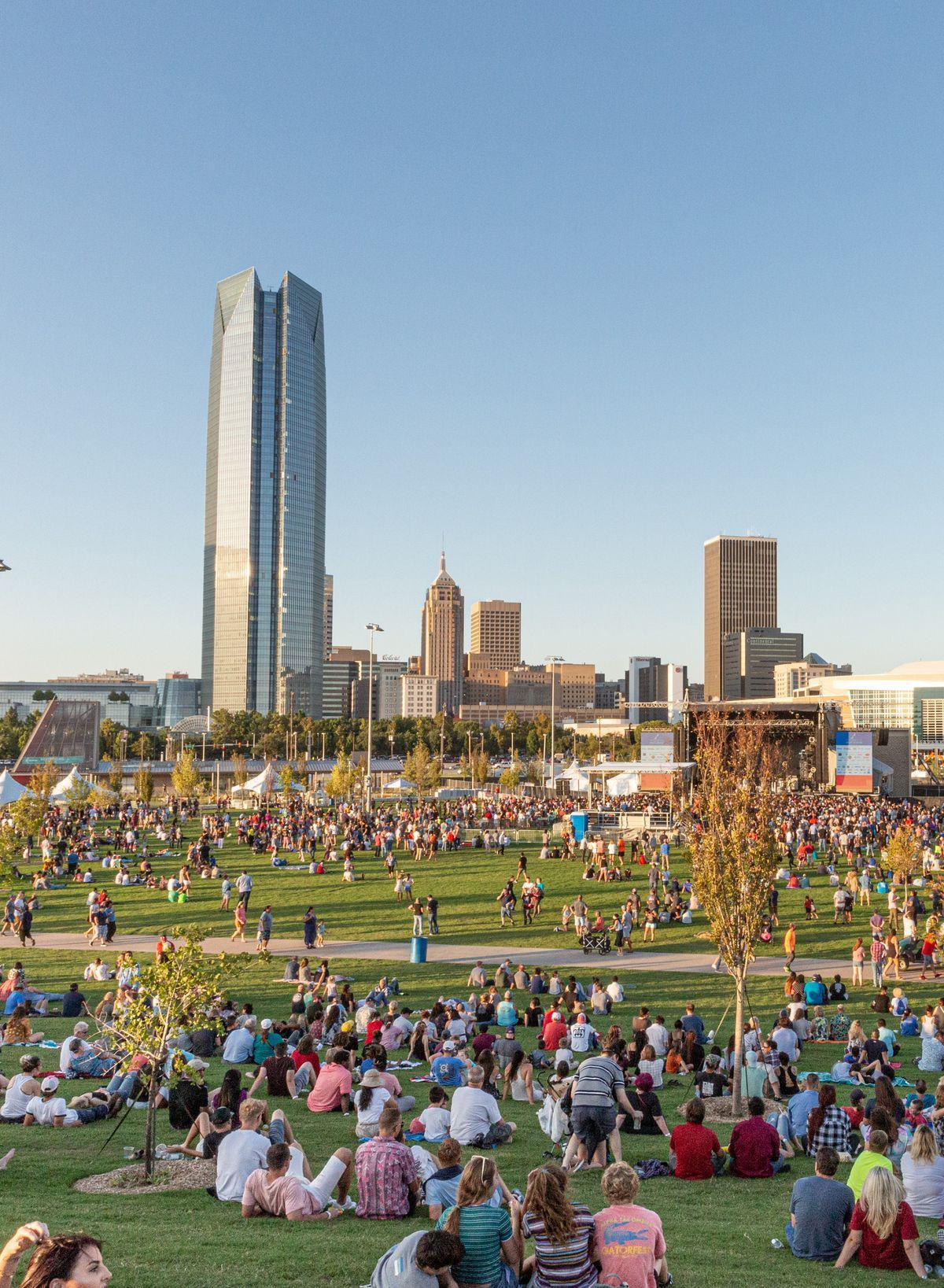 Water pouring into a clear glass on a dark, wet surface. Blue tones dominate.
