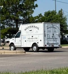 White Silvernail service truck parked on the road.