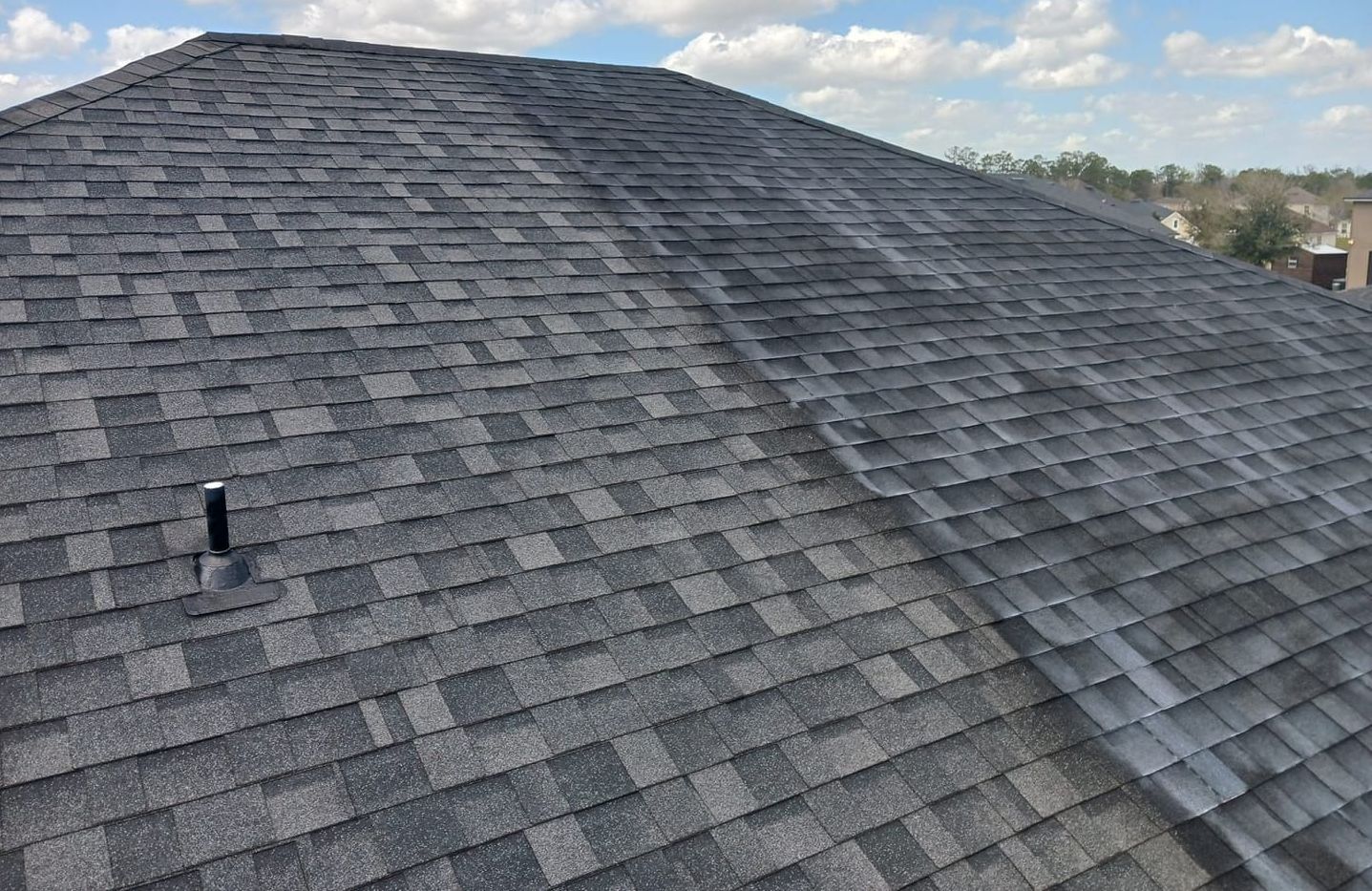 A roof with a lot of shingles and a chimney on it.
