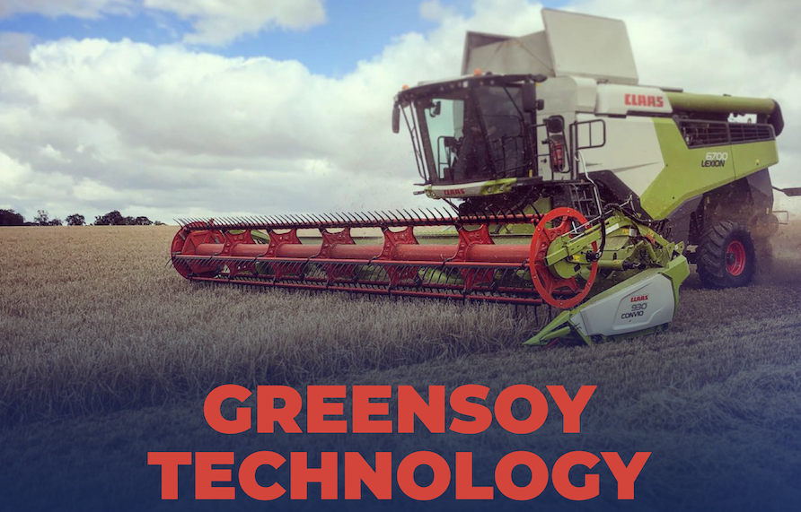 A combine harvester in a field with the words greensoy technology on the bottom