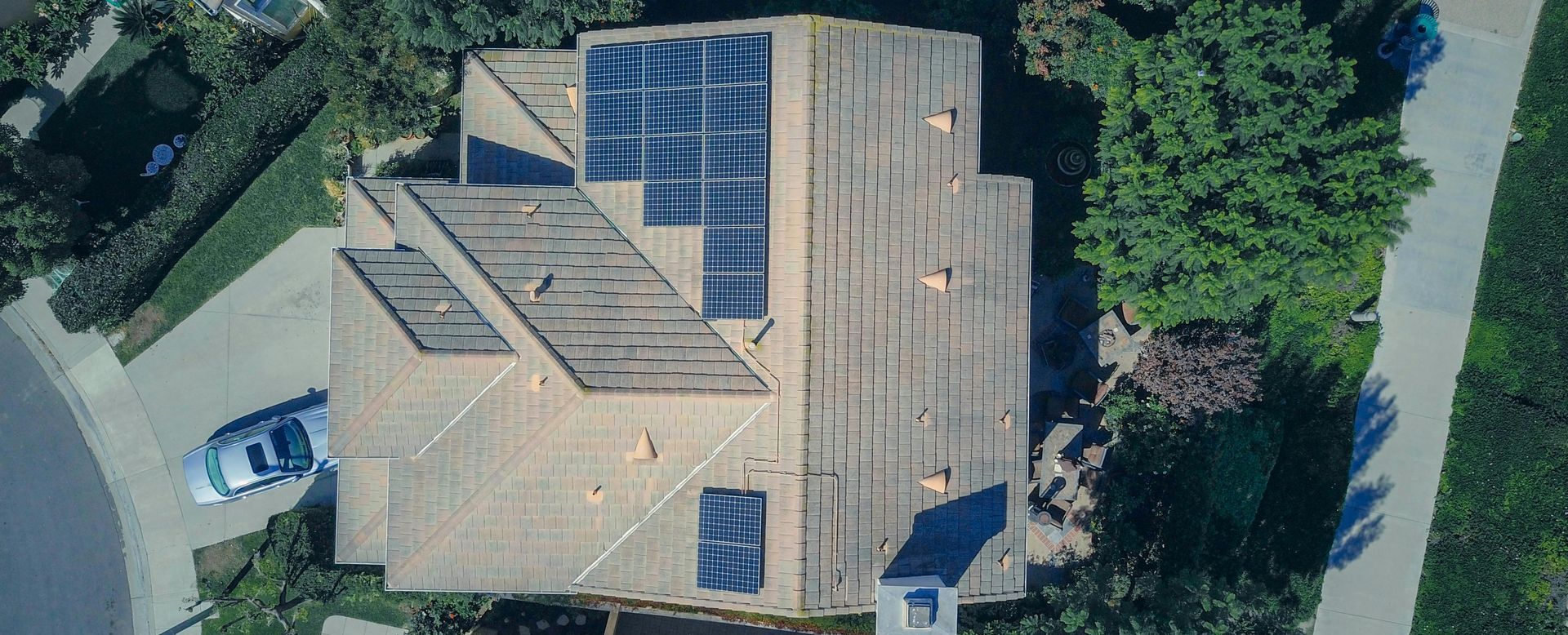Solar panels with roof rejuvenation spray