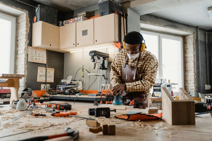 carpenter at work in his workshop with high end equiplent