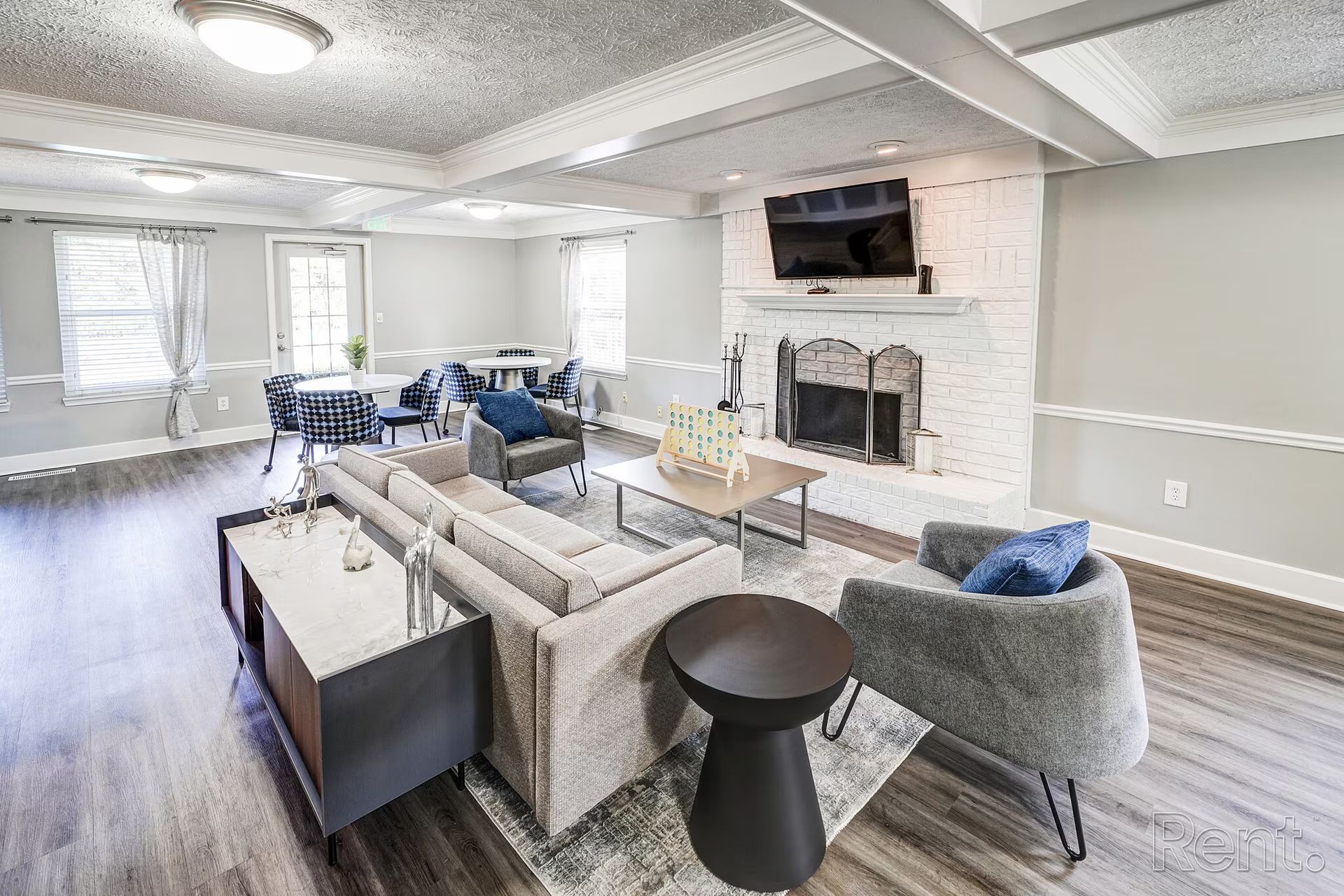A living room filled with furniture and a fireplace.