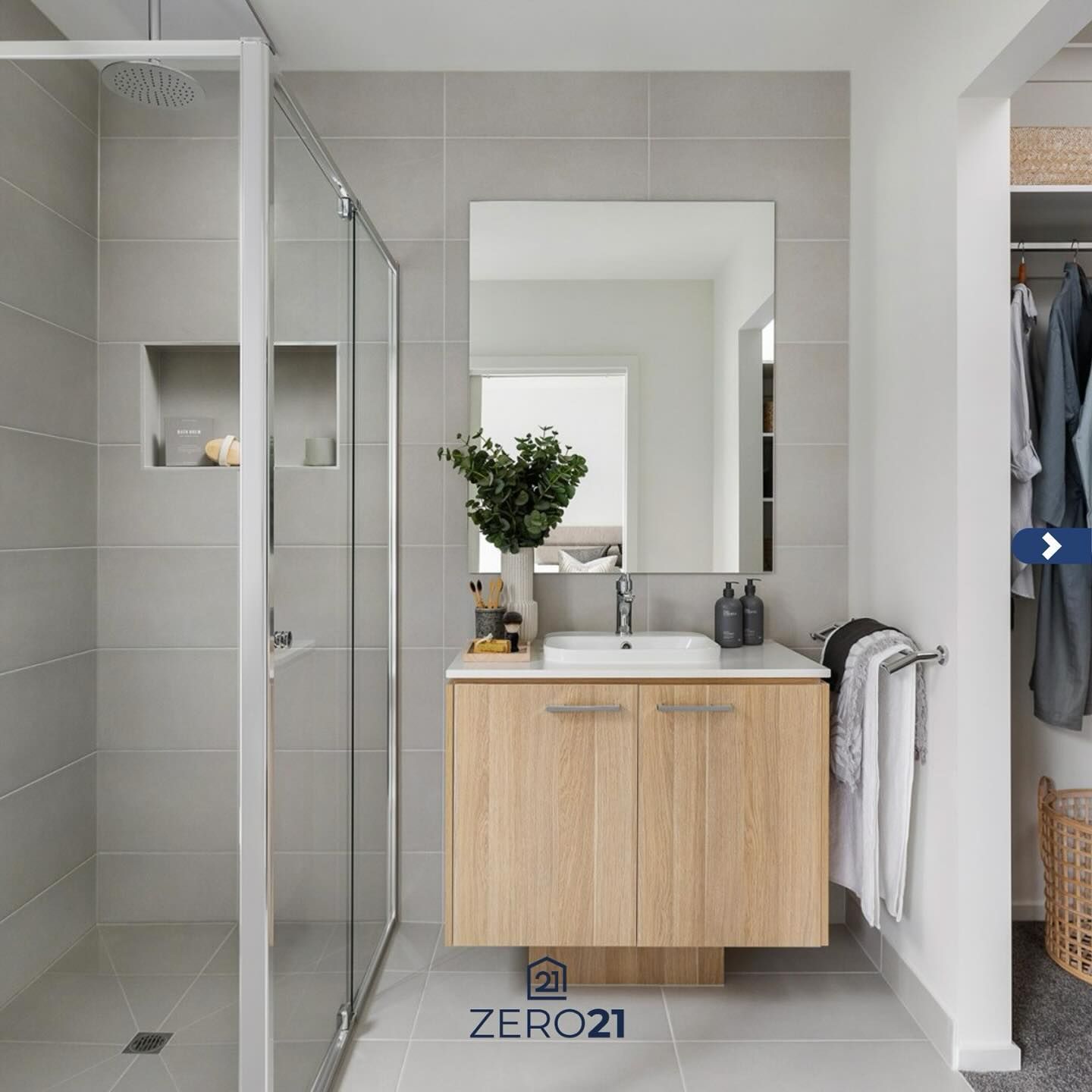 Bathroom with a glass shower, wooden vanity, large mirror, and gray tiles. — Zero 21 Fit-Outs & Joinery: Kitchen Renovation Gold Coast in Molendinar, QLD