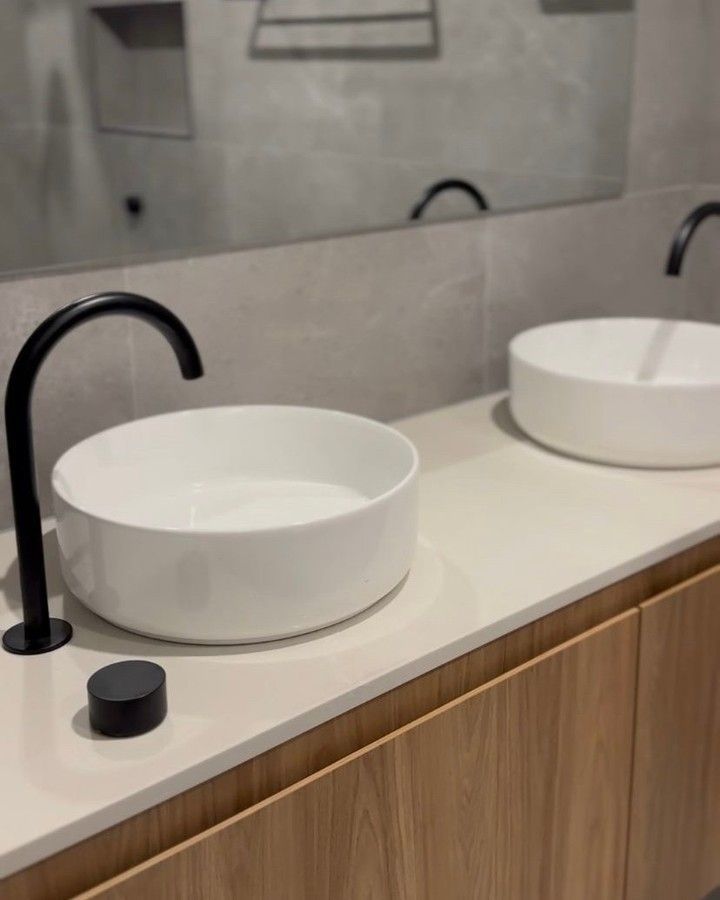 Two white vessel sinks with black faucets on a light-colored countertop above wood cabinetry. — Zero 21 Fit-Outs & Joinery: Kitchen Renovation Gold Coast in Robina, QLD