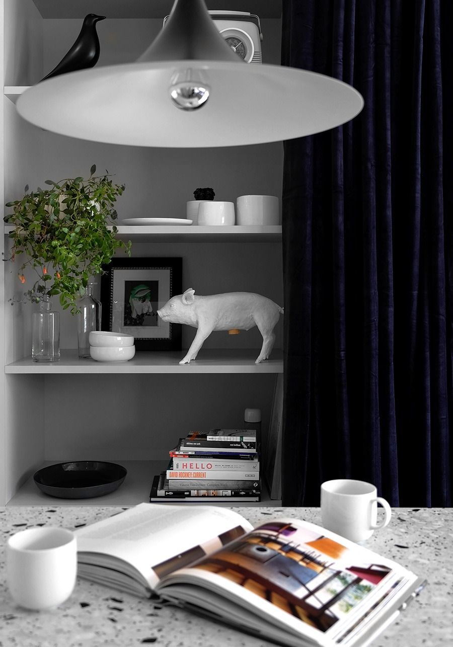 White Kitchen Shelves With Decor Including a Pig Statue, Books, and a Large Pendant Light — Zero 21 Fit-Outs & Joinery: Kitchen Renovation Gold Coast in Molendinar, QLD