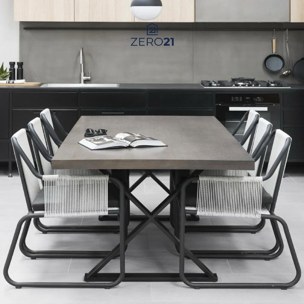 Sleek Kitchen With Black Cabinets And Dining Setting — Zero 21 Fit-Outs & Joinery: Kitchen Renovation Gold Coast in Molendinar, QLD