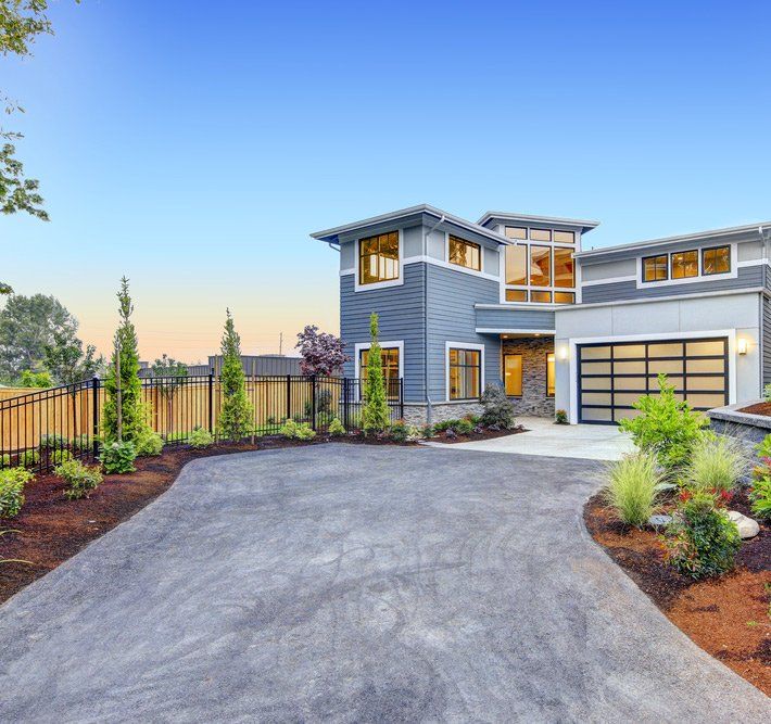 Garage With Glass Door And Long Concrete driveway — Maitland Concreting Specialists In Wyong NSW