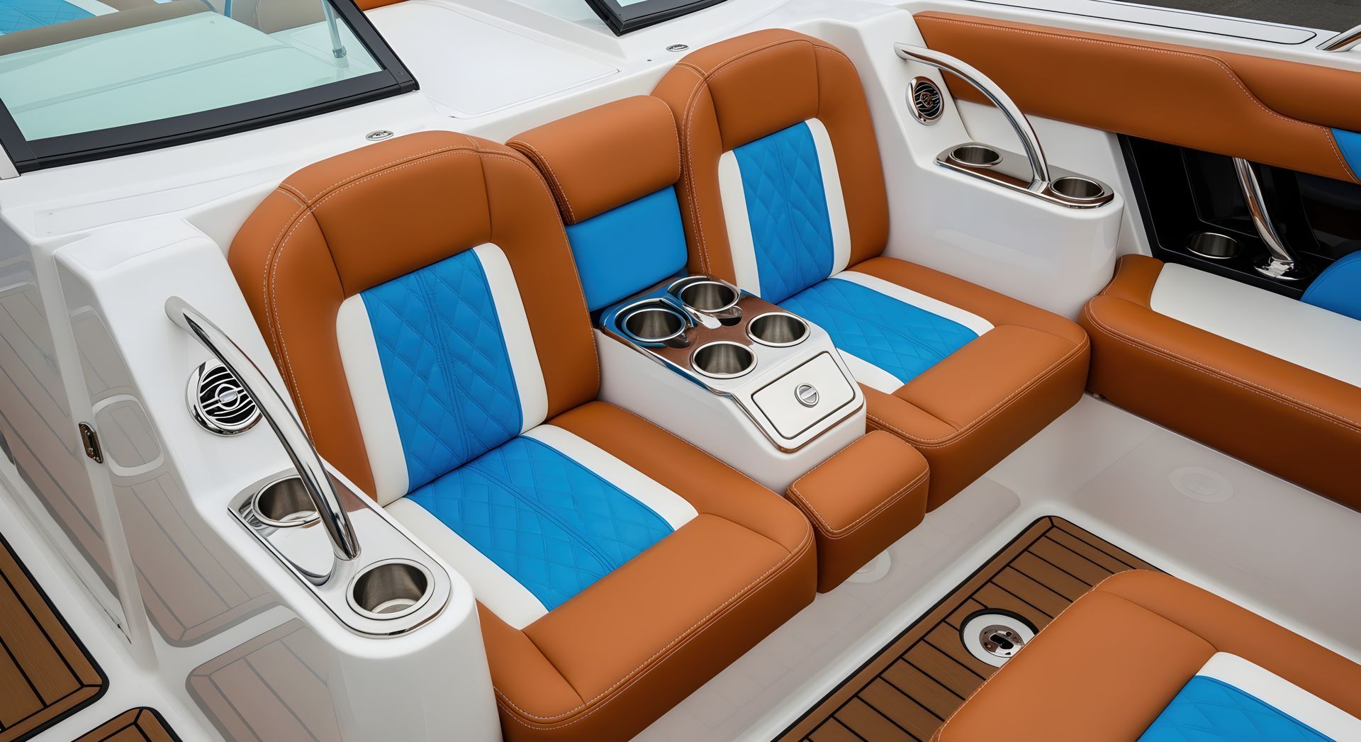 Brown and blue boat seats with cup holders.