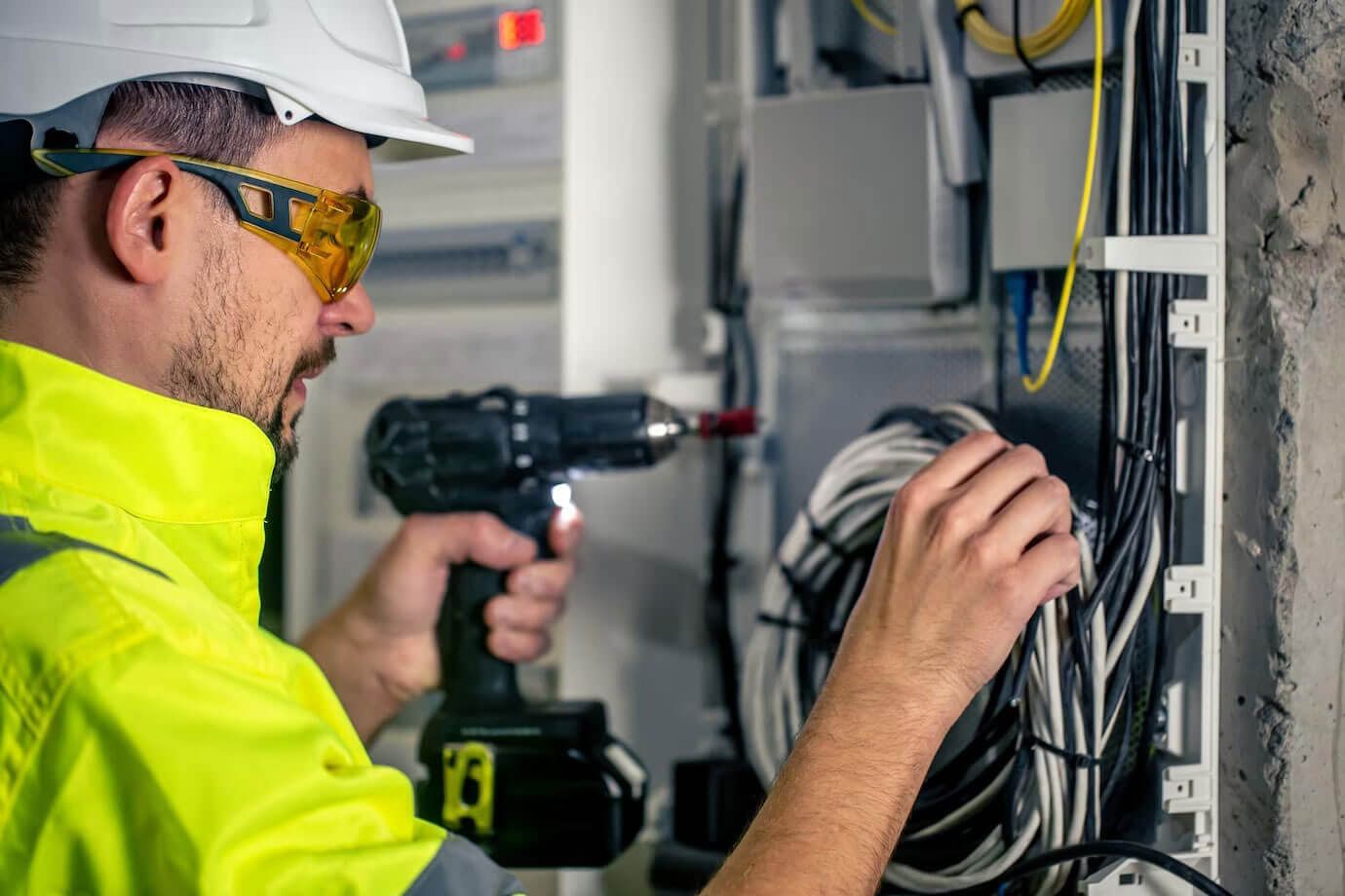 Electrical Technician Working on a Circuit Board