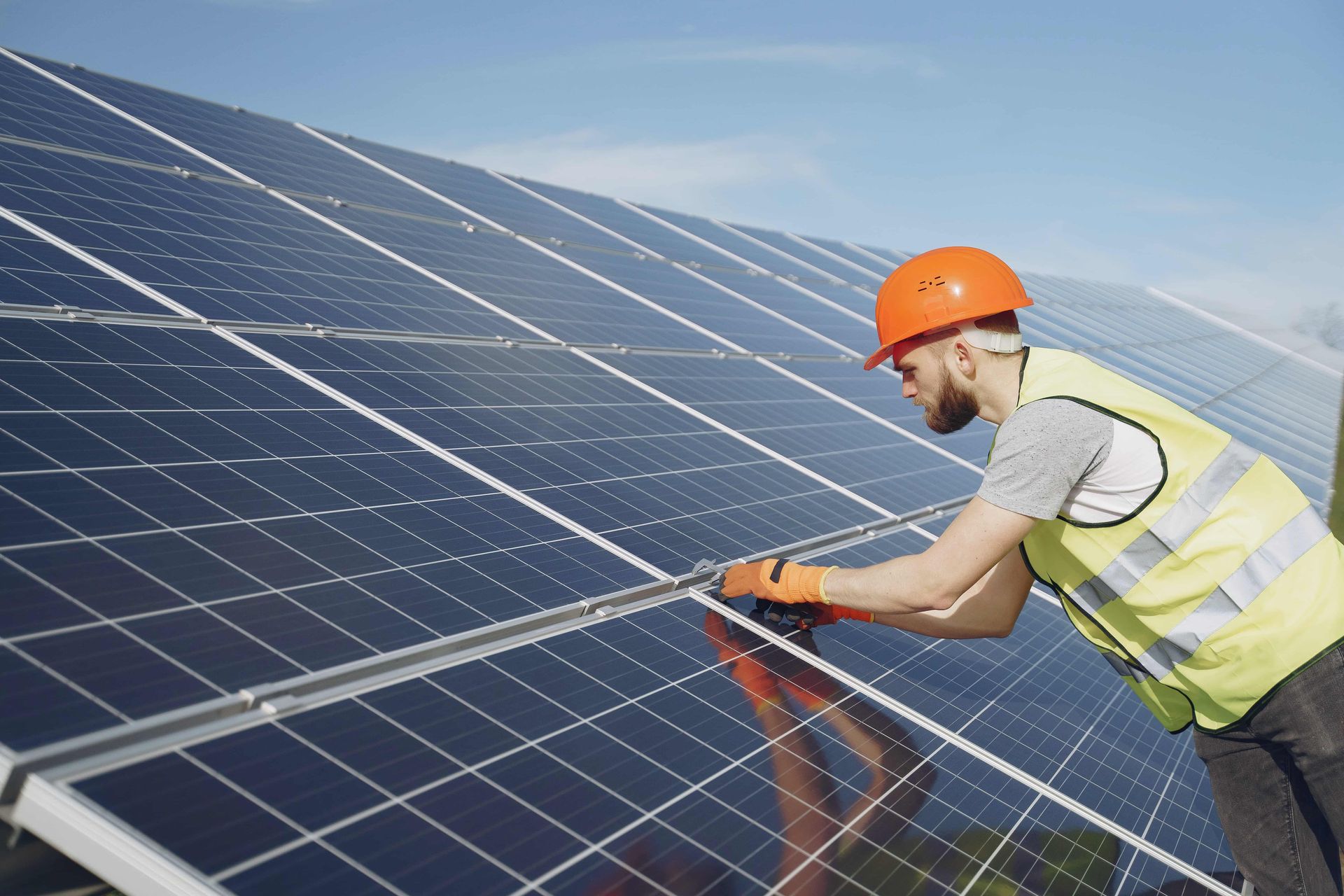 Technician Installing Solar Panel