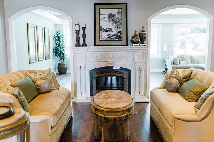A living room filled with furniture and a fireplace.
