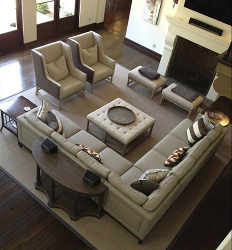 An aerial view of a living room with a couch and chairs.