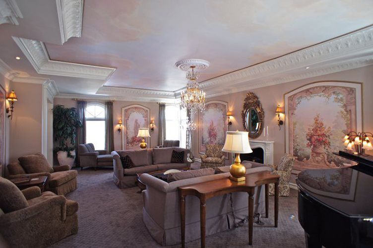 A living room filled with furniture and a piano.