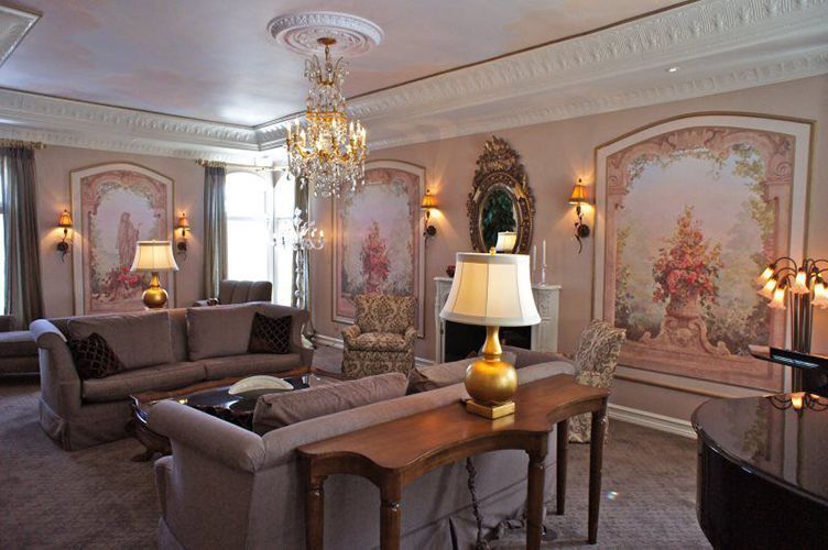 A living room filled with furniture and a chandelier.