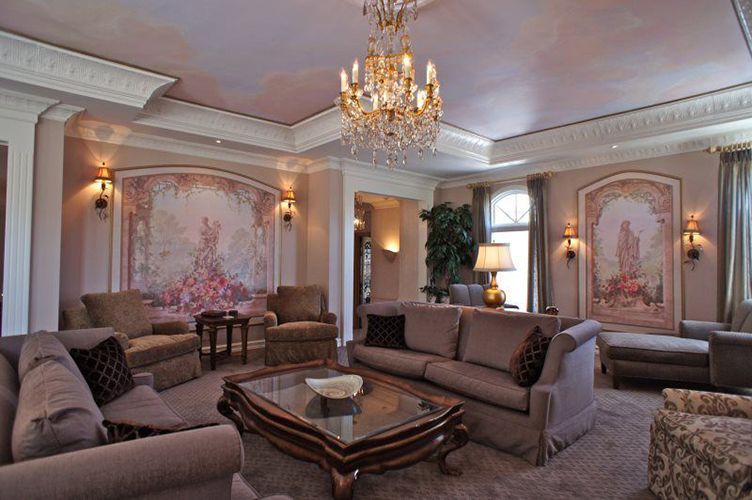 A living room filled with furniture and a chandelier.