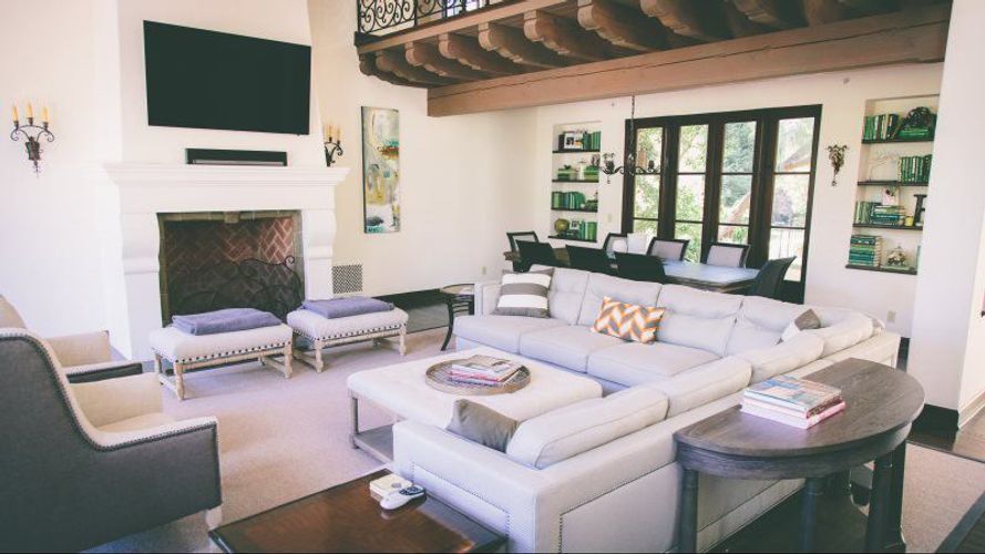 A living room filled with furniture and a fireplace.