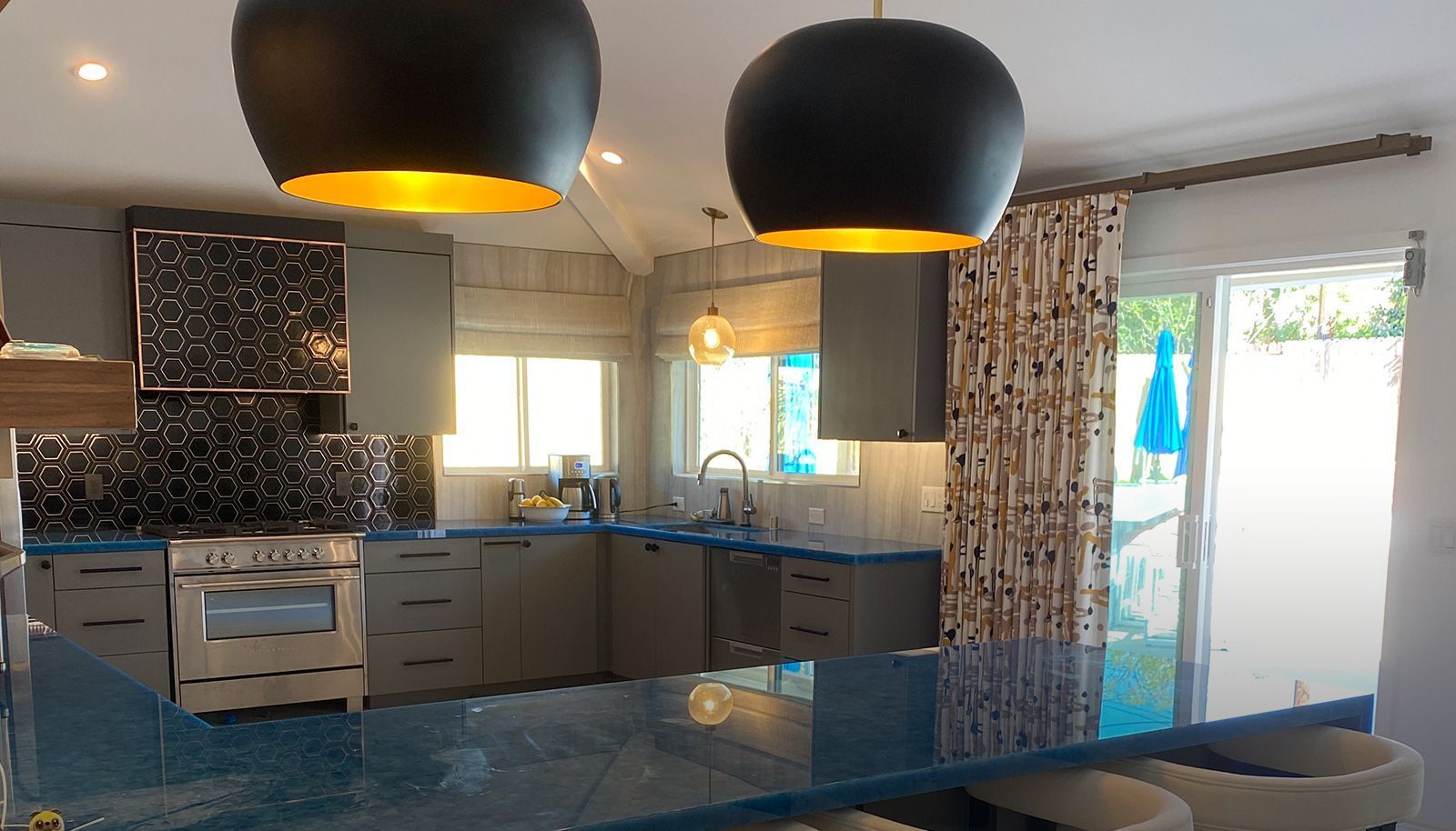 A bathroom with two sinks, a tub, a mirror and a television.
