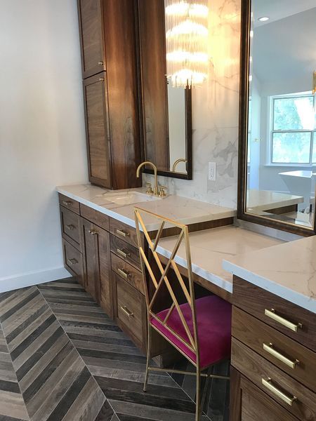 A bathroom with a vanity and a mirror